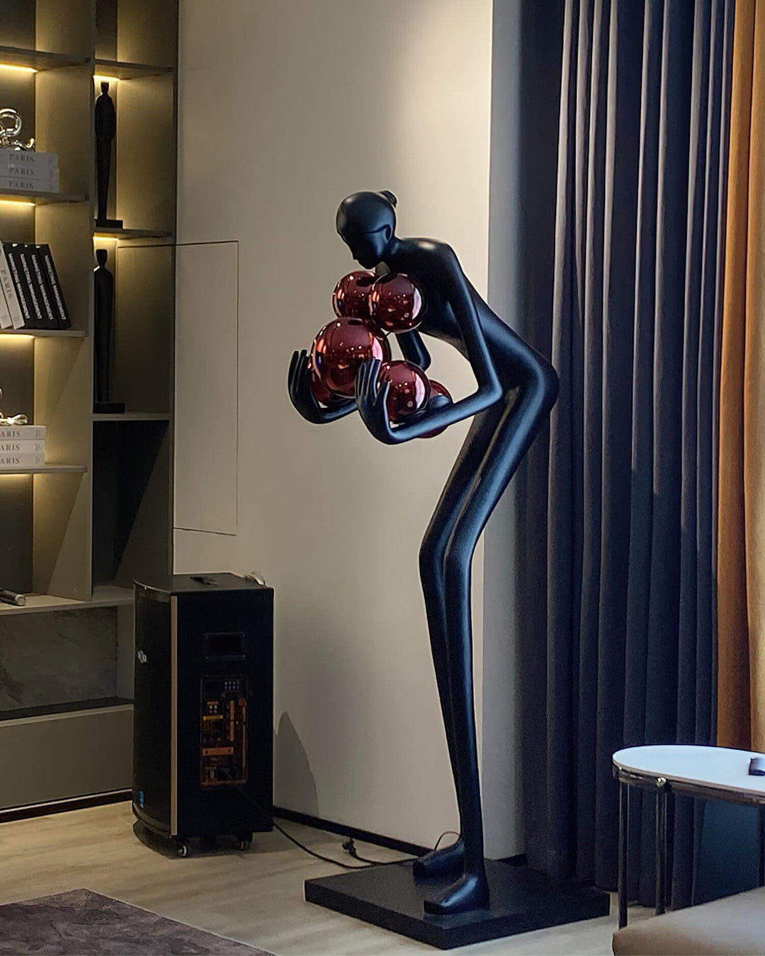 Velmora Sculptural Floor Lamp featuring a sleek black design with decorative red orbs, perfect for art deco living room decor.
