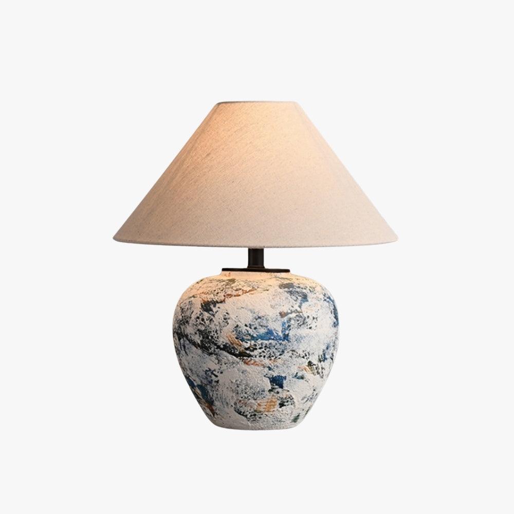 Neoclassical ceramic table lamp with textured blue design and beige shade, ideal for living room or farmhouse decor.