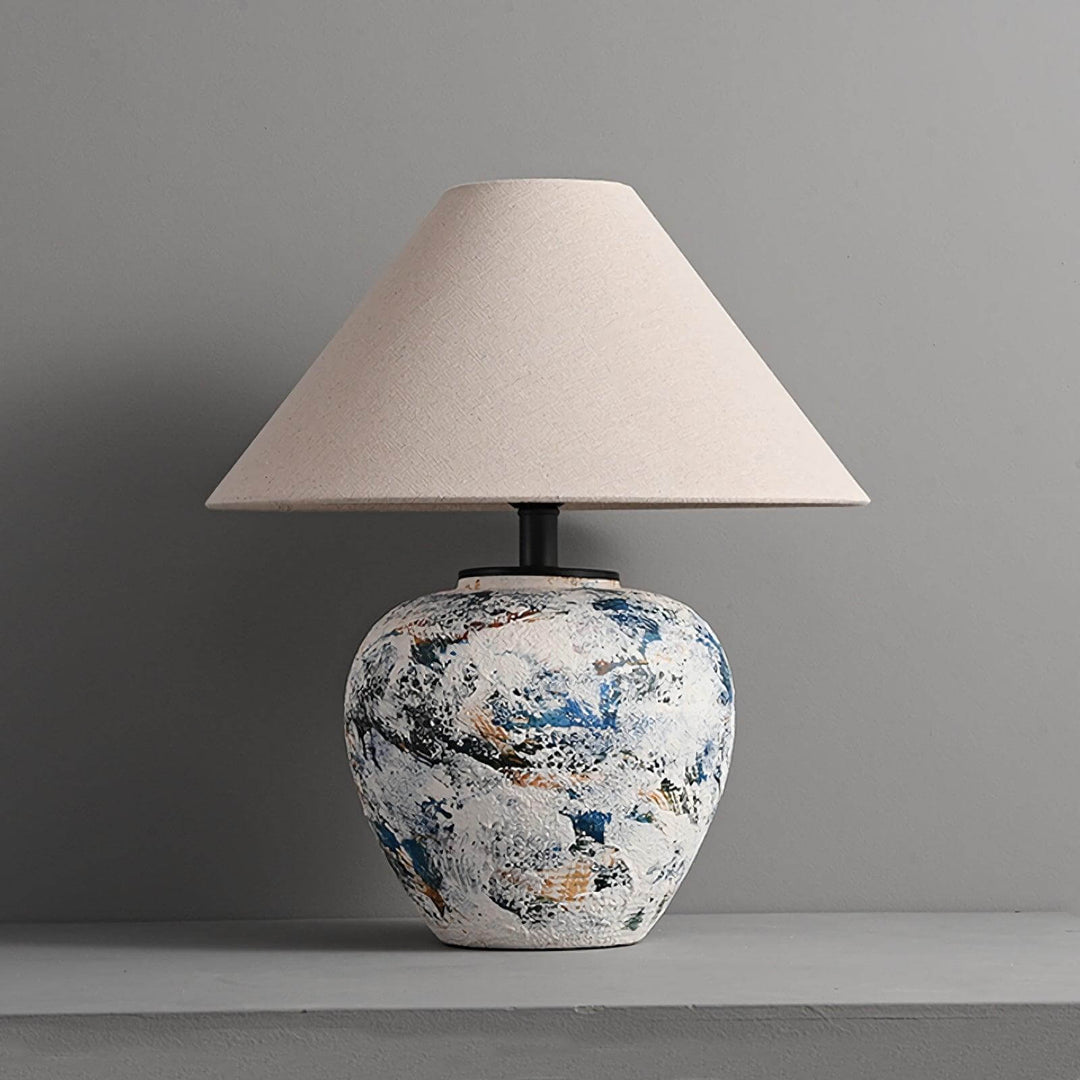 Neoclassical ceramic table lamp with a textured vase base and beige shade, perfect for living room or farmhouse decor.