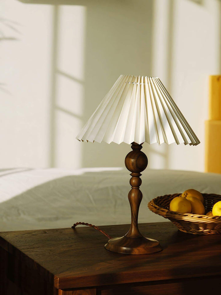 Zulu Pleated Table Lamp on a wooden table, a vintage wood table lamp perfect for side or console tables.