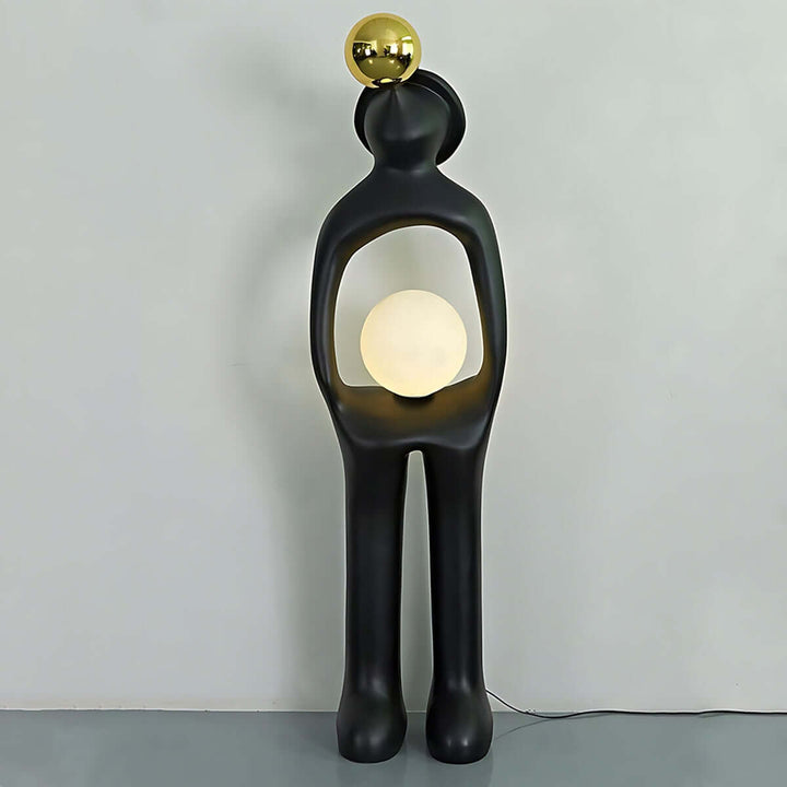 Sculptural art deco floor lamp featuring a unique human figure design, ideal for modern living room lighting.