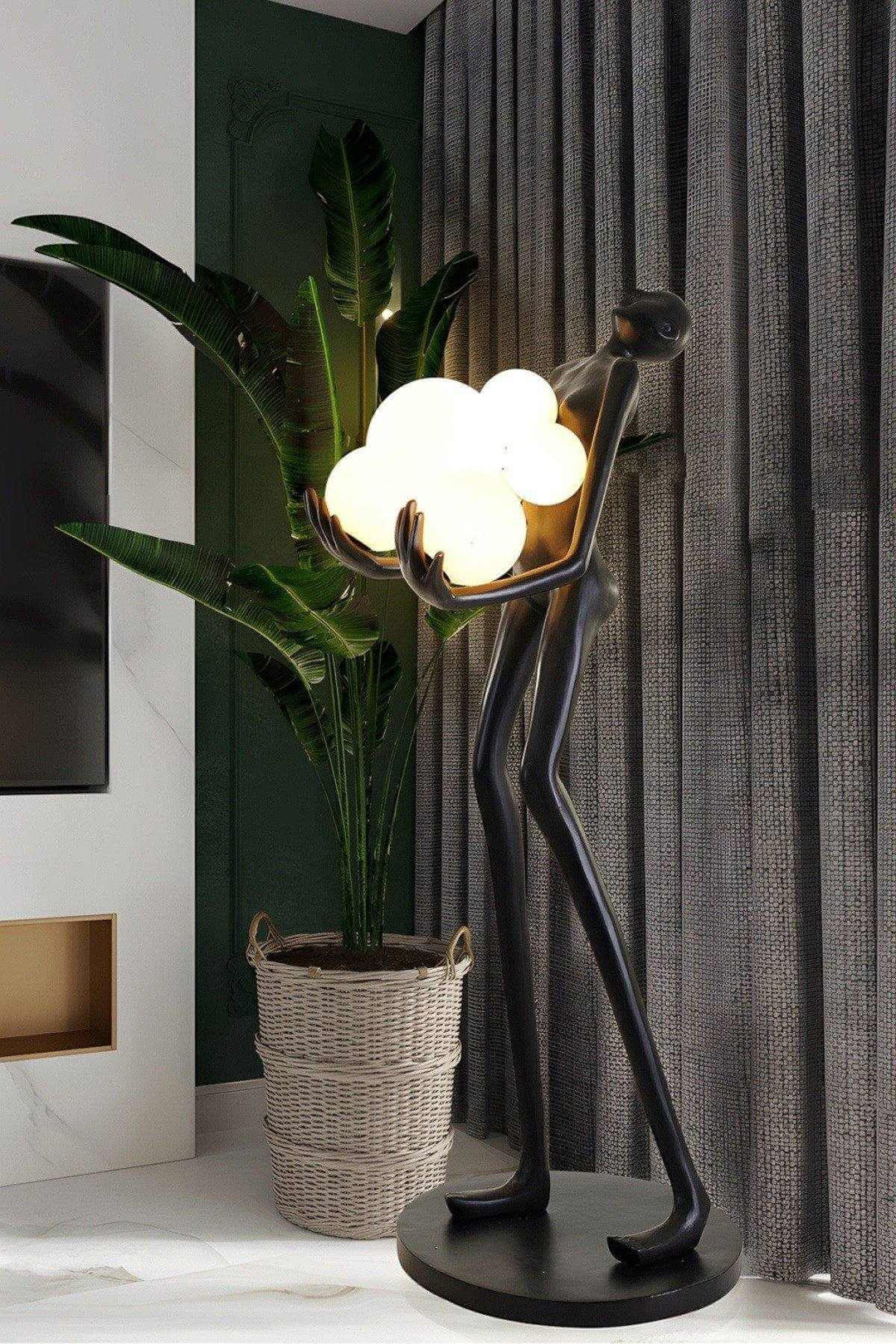 Sculptural floor lamp in art deco style, featuring a figure holding glowing globes, perfect for living room decor.