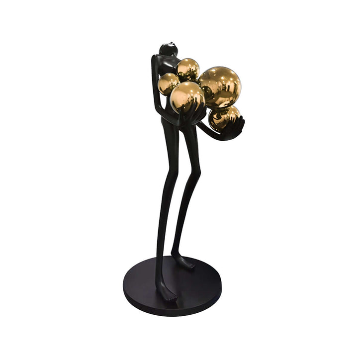 Vornix sculptural floor lamp featuring a black figure holding gold globes, perfect for art deco living room decor.