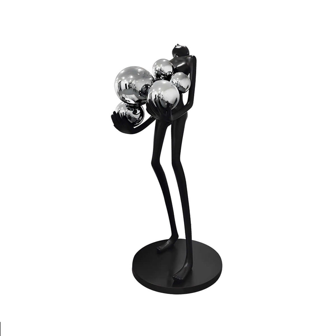 Sculptural floor lamp featuring a slender figure holding shiny spheres, perfect for modern decor.