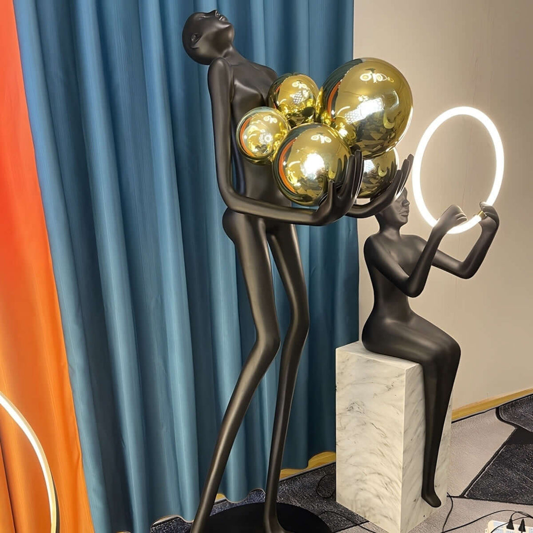 Sculptural floor lamp with glossy orbs, perfect for art deco decor in a stylish living room.
