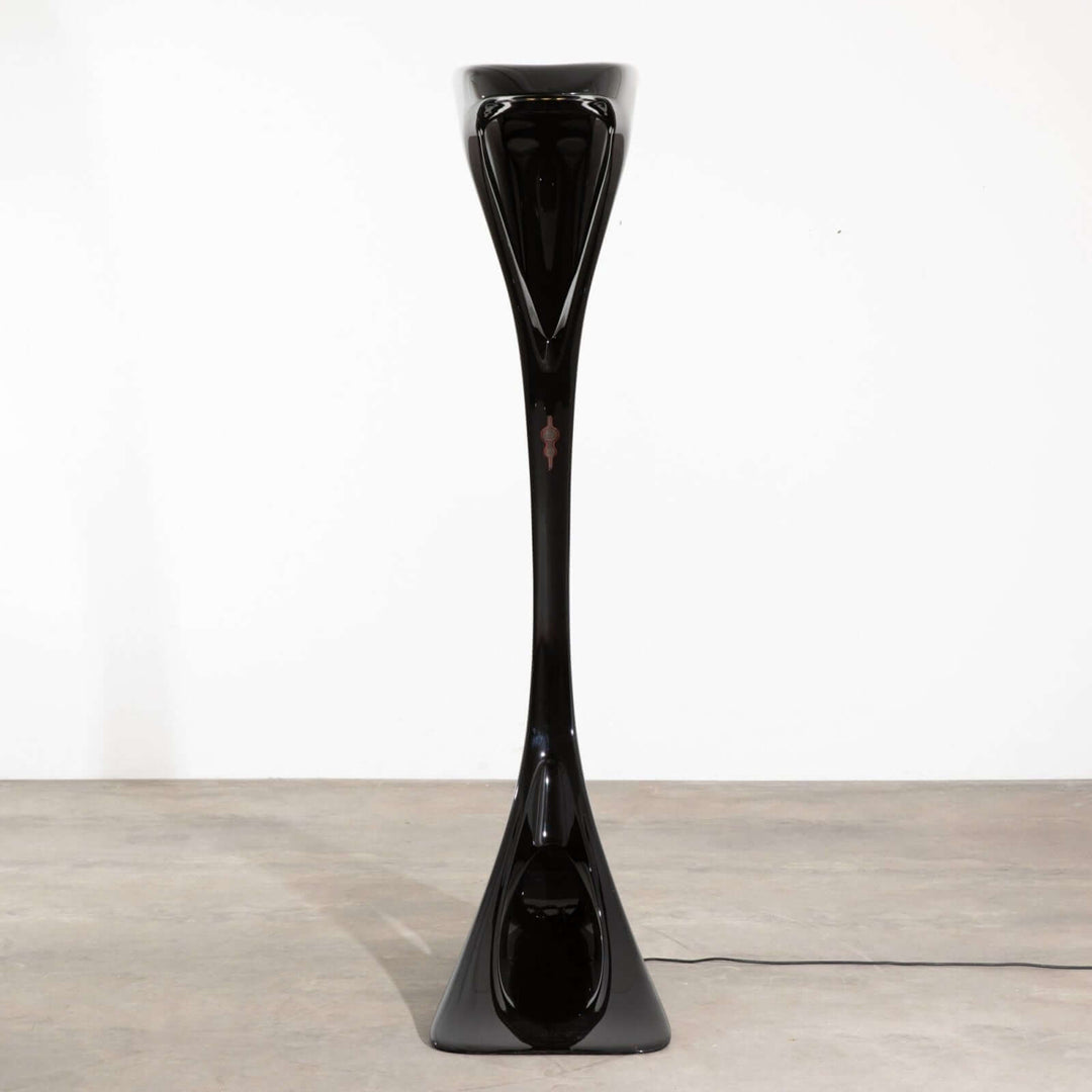 Sculptural Vyntra Floor Lamp in sleek black design, an art deco style floor lamp perfect for living room lighting.