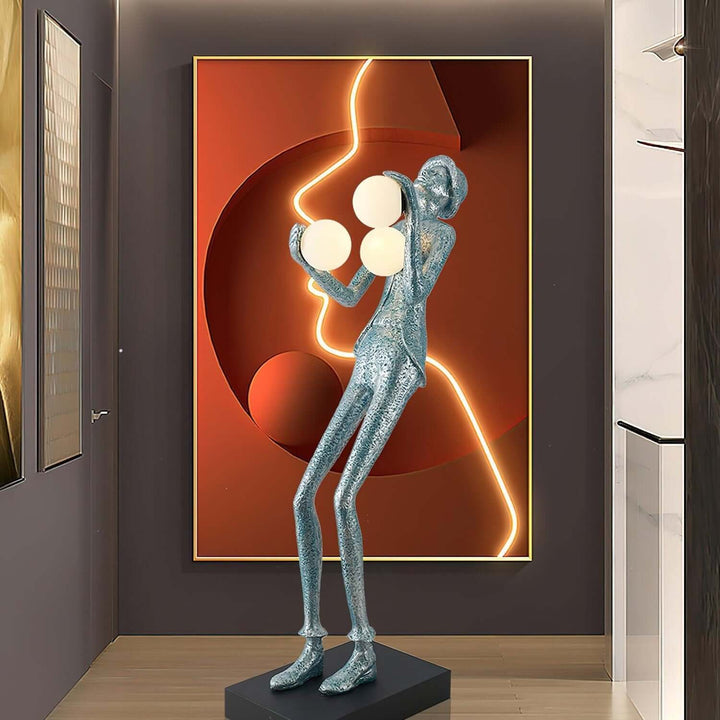 Sculptural floor lamp with artistic design, perfect for art deco decor in a living room setting.