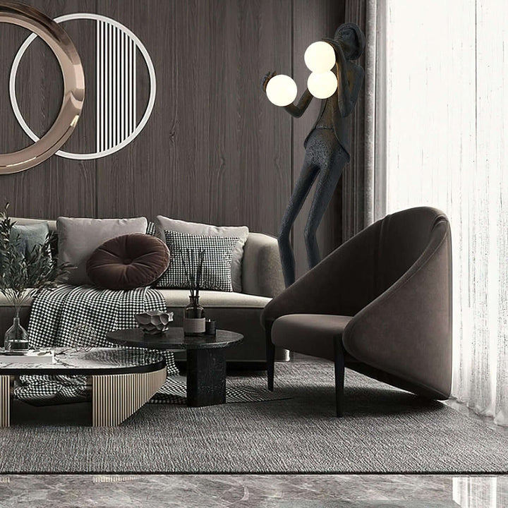 Sculptural art deco floor lamp in modern living room with stylish furniture and decor, enhancing the cozy ambiance.