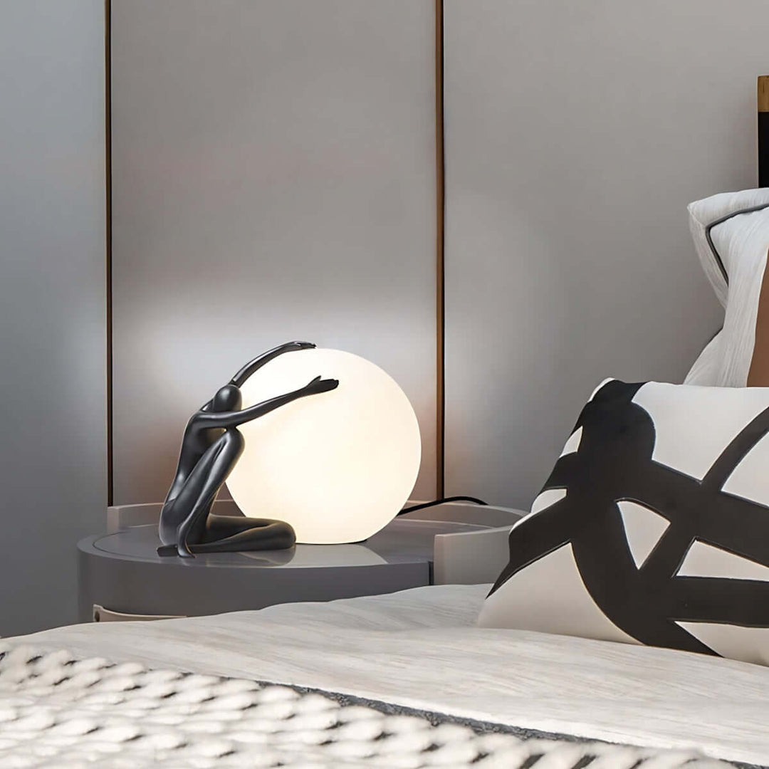 Zelvora sculptural table lamp on bedside table, featuring an art deco design that enhances living room aesthetics.