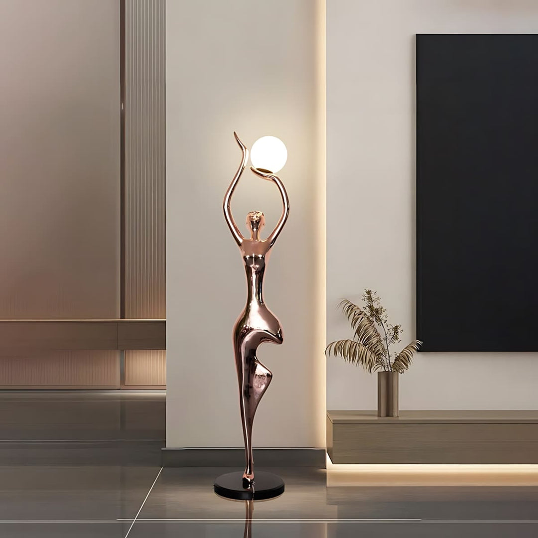 Sculptural floor lamp in art deco style, featuring a graceful figure design, perfect for enhancing living room decor.