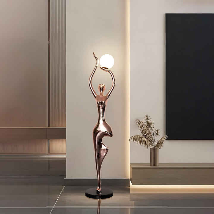 Sculptural floor lamp in art deco style, featuring a graceful figure design, perfect for enhancing living room decor.