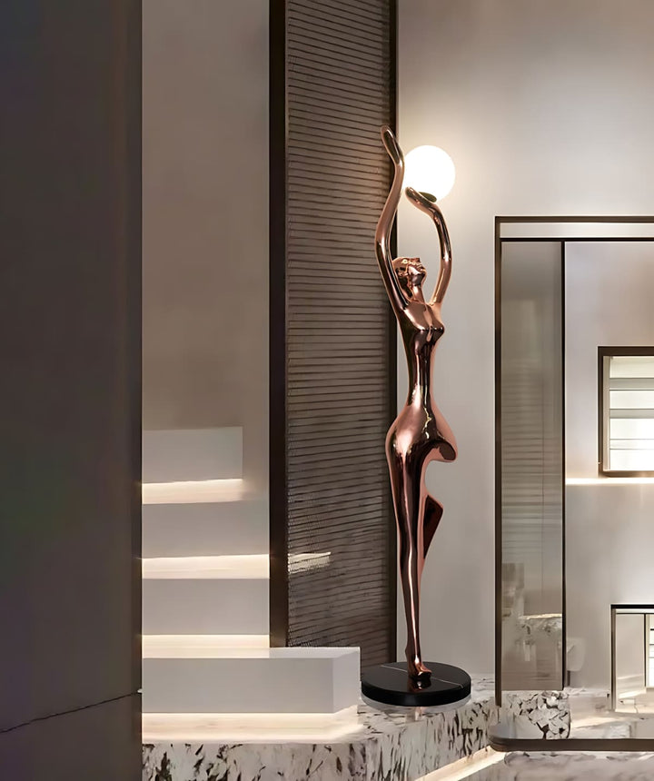 Sculptural art deco floor lamp in bronze finish, ideal lighting for modern living room decor, creating an elegant ambiance.