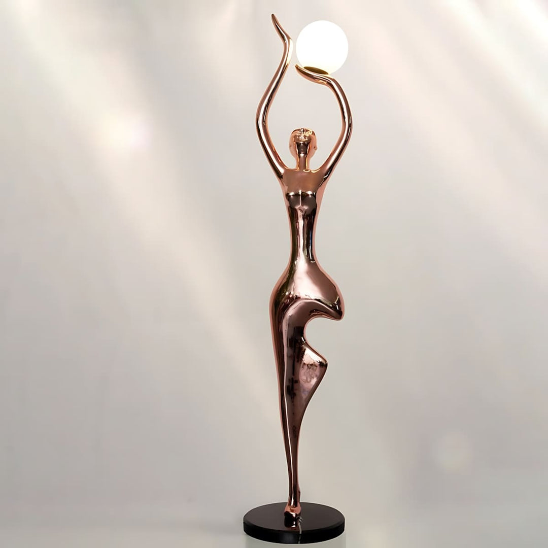 Sculptural floor lamp in art deco design, featuring a graceful figure holding a light globe, perfect for living room decor.