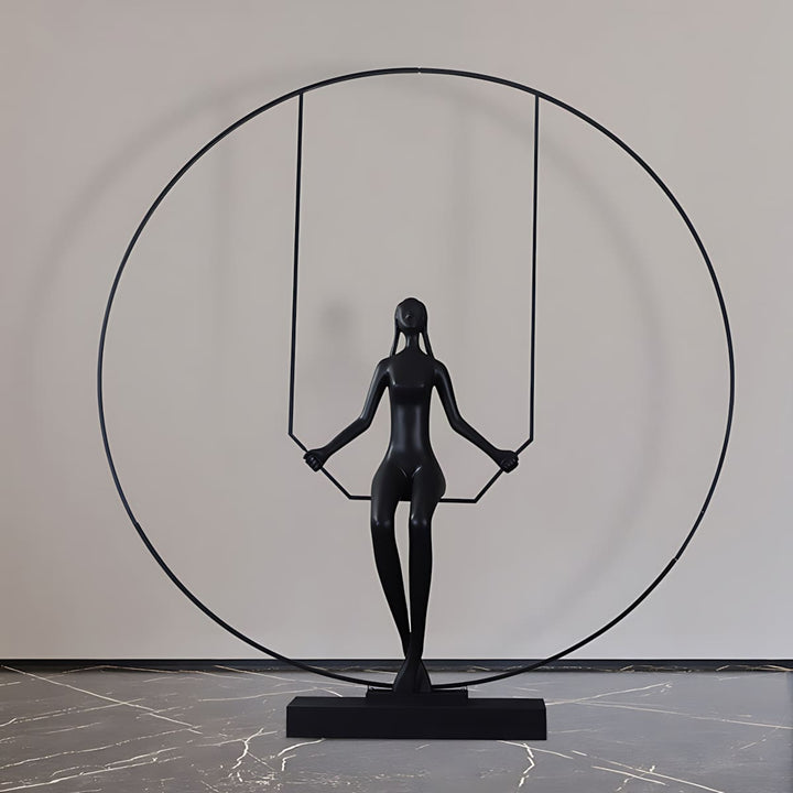 Resin sculpture of a woman on a swing, perfect for living room decorations and Art Deco styled spaces.