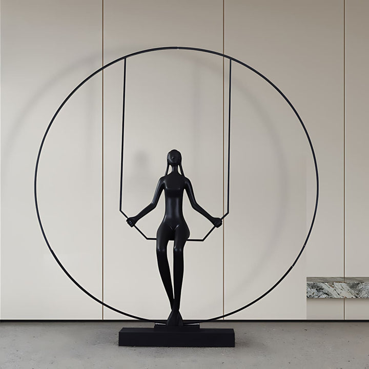 Zinelo Sculpture: Black resin sculpture with circular swing, ideal for Art Deco living room decorations.