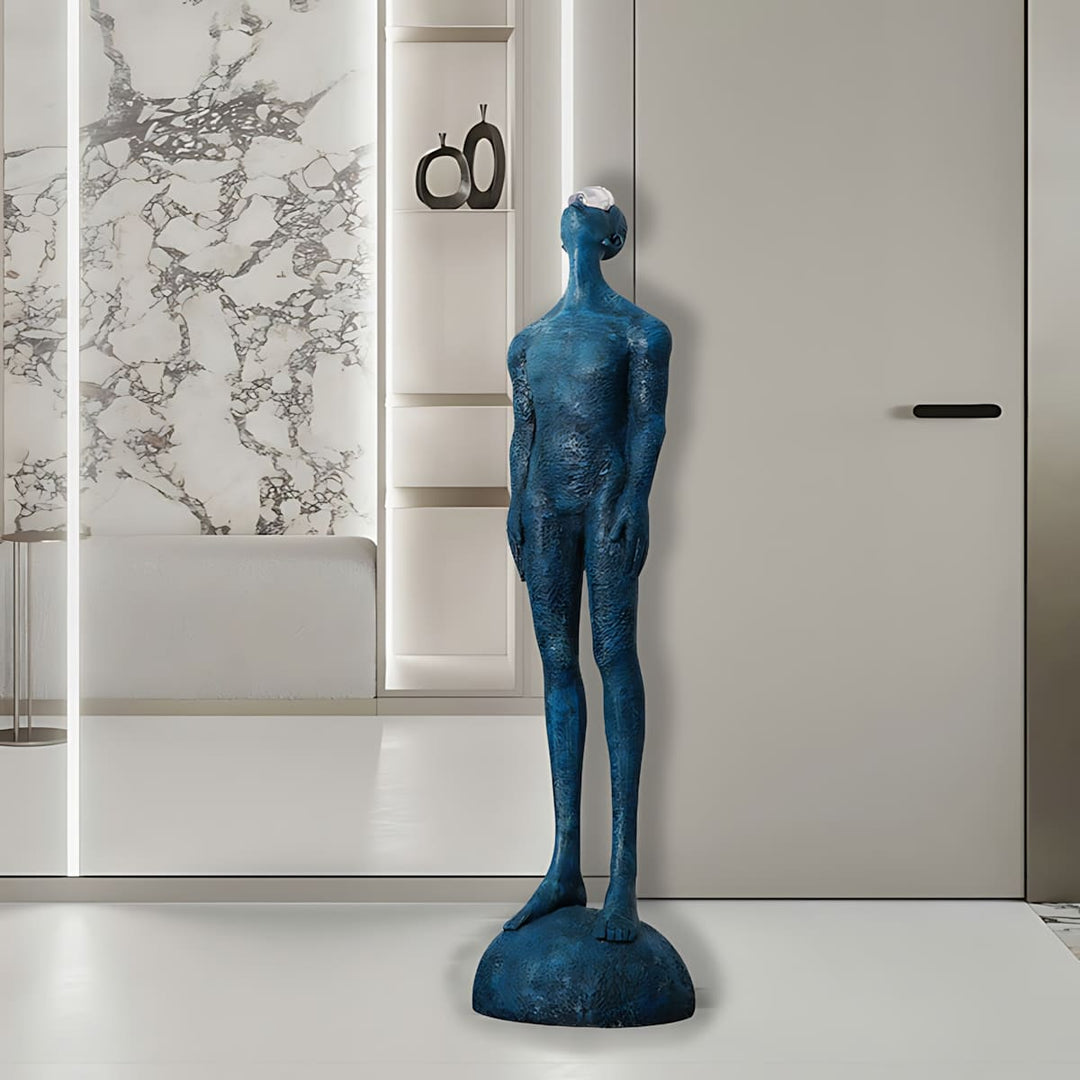 Zoreva blue resin sculpture standing in a modern living room, ideal for decorative ornaments and Art Deco style.
