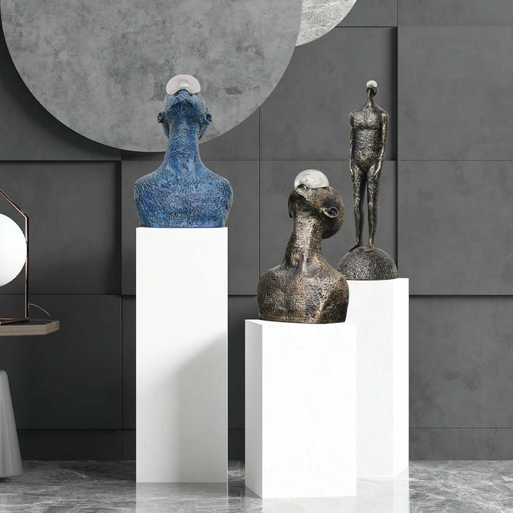 Zoreva Resin Sculpture trio on white pedestals, modern Art Deco style decorative ornaments for living room.