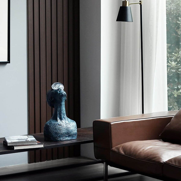 Zoreva resin sculpture as a decorative ornament in a modern living room decor setting.
