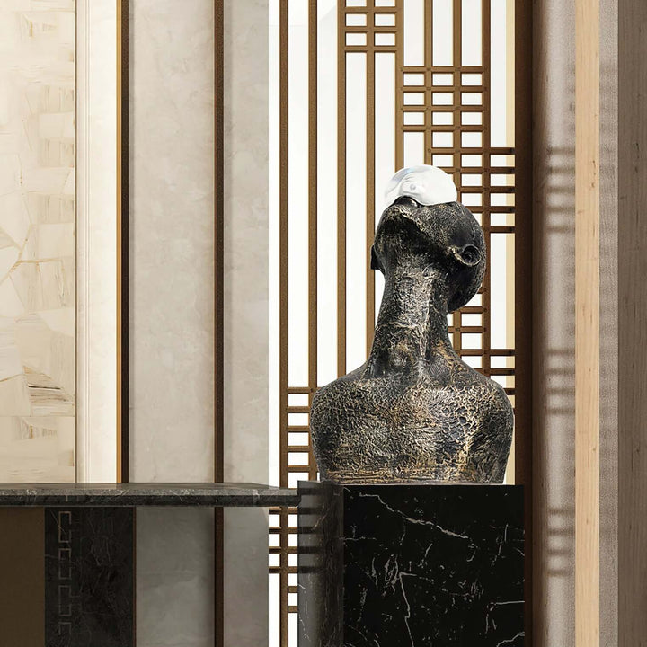 Zoreva resin sculpture displayed as a decorative ornament in a modern living room setting, blending Art Deco style.