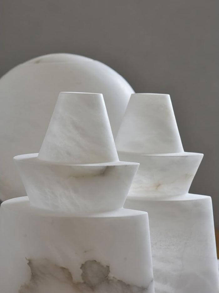 Elegant alabaster decorative sculptures showcasing unique patterns and shapes, perfect for home decor.