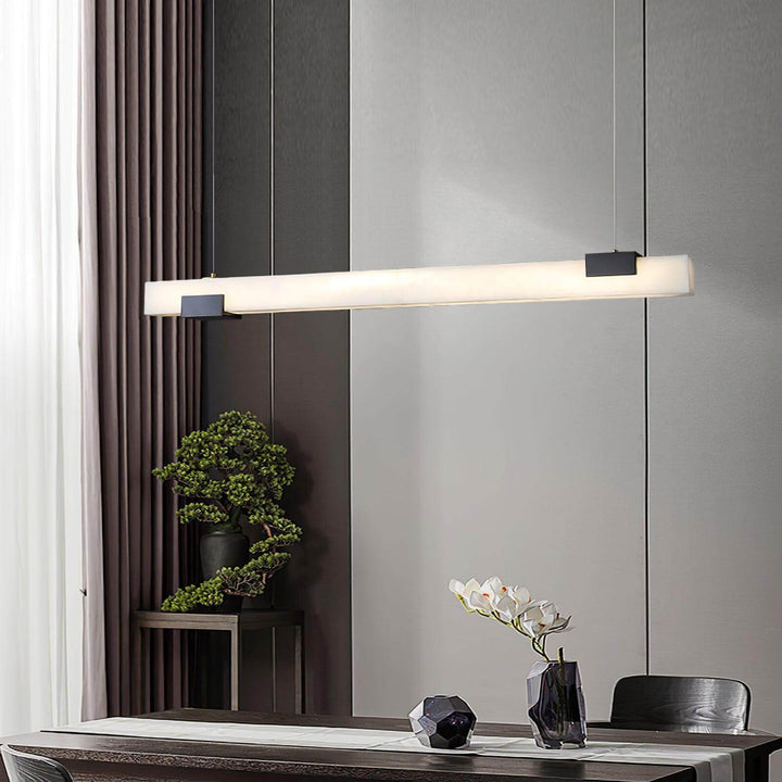 Cary Alabaster Pendant Light in contemporary dining setup, showcasing linear design and modern elegance.