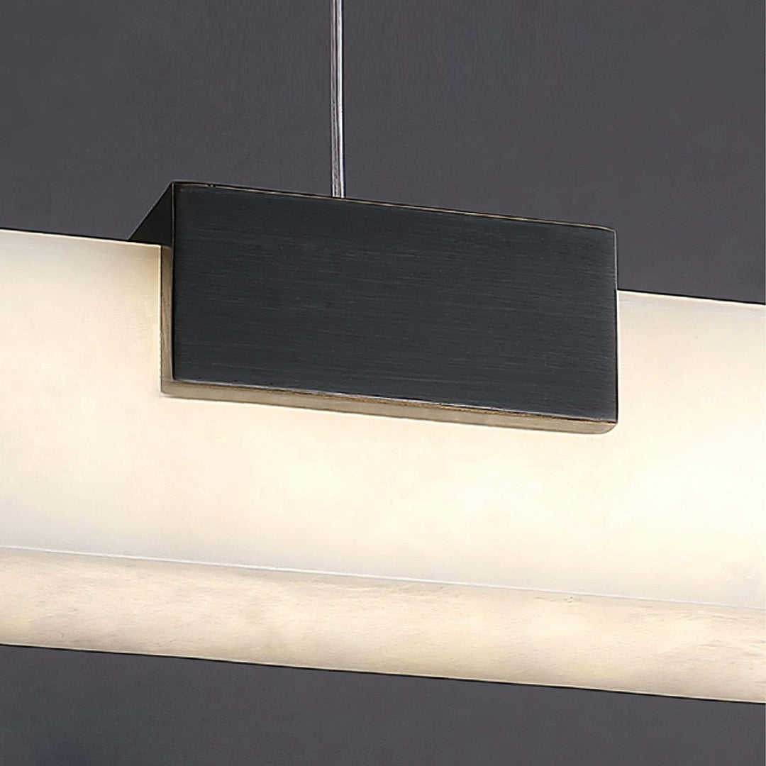 Cary Alabaster Pendant Light featuring a contemporary design with bronze finish and alabaster shade, ideal for kitchen island lighting.