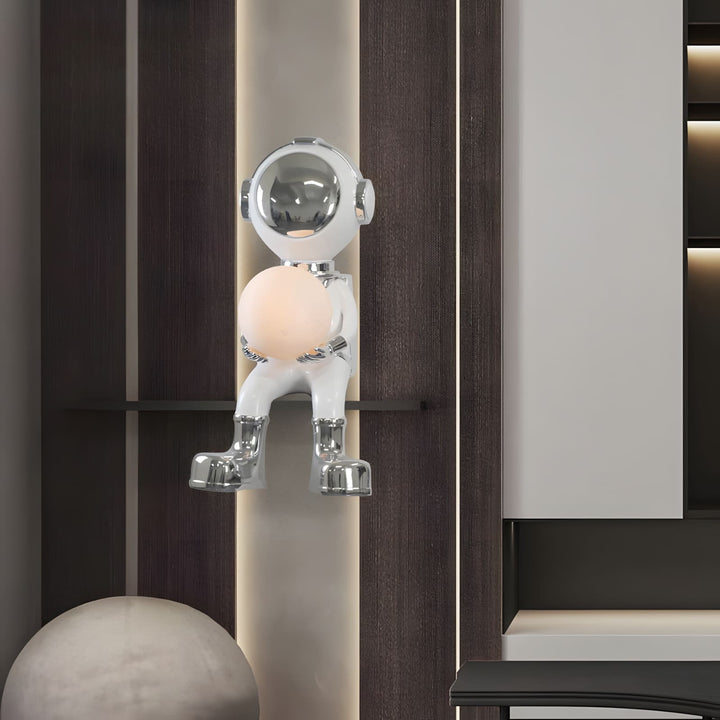 Sculptural astronaut lamp with round light, adding a playful touch to modern home decor.