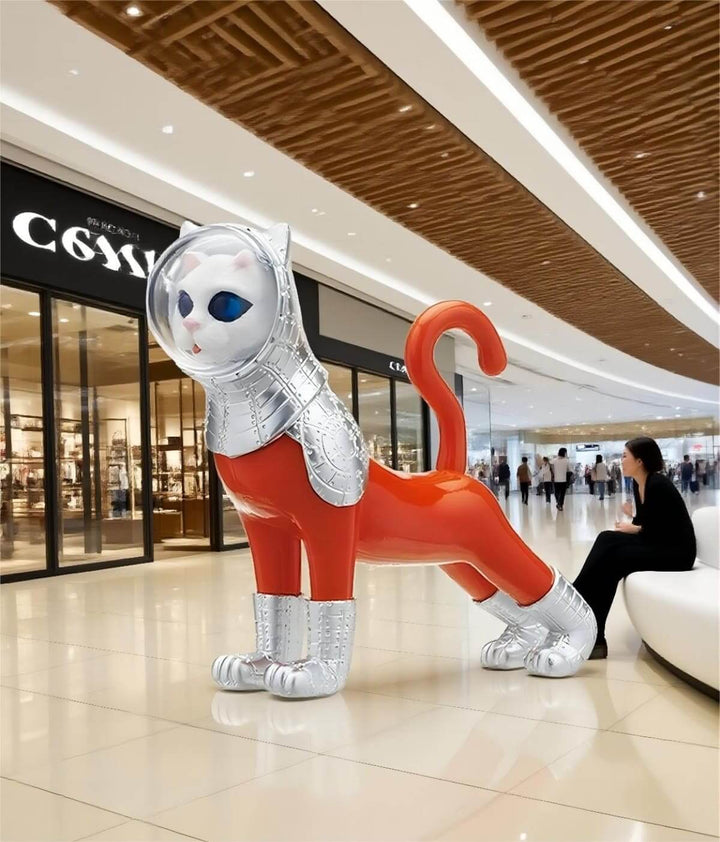 Colorful cat sculpture in a modern mall, showcasing a striking art deco style and unique design.