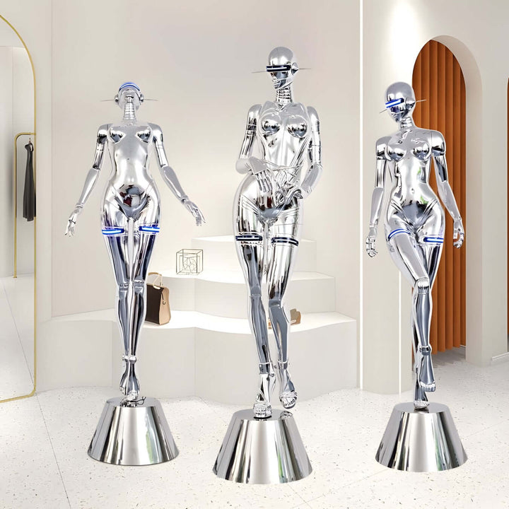 Sculptural chrome mannequins on sleek bases in a modern interior, showcasing contemporary design and elegance.