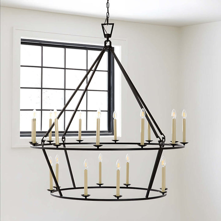 Modern mid-century 12-light chandelier in black, featuring candle-style bulbs, ideal for dining room decor.