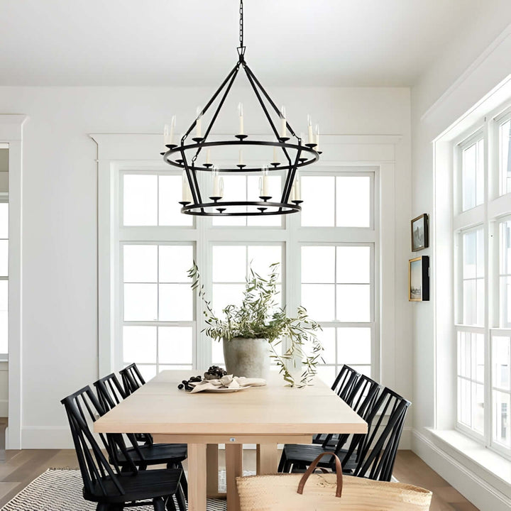 Luvo Serin Chandelier in modern dining room, featuring a black finish above a wooden table with black chairs.