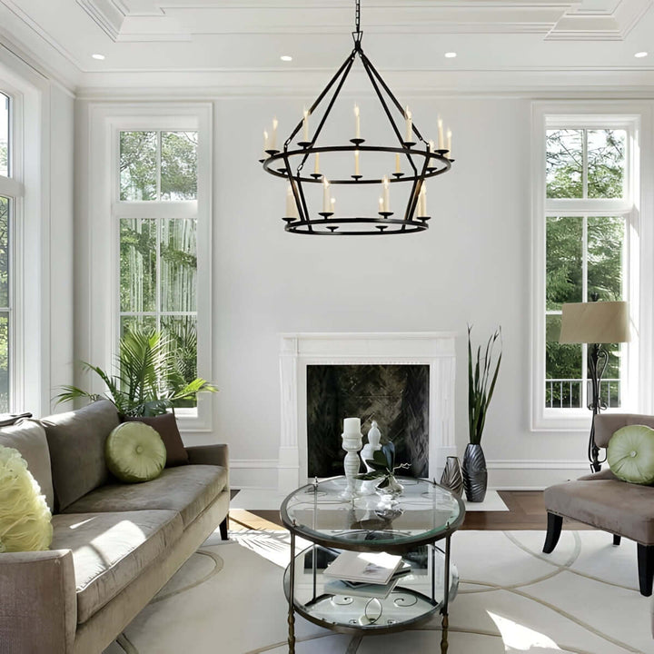 Luvo Serin chandelier illuminating modern living room with stylish seating and large windows.