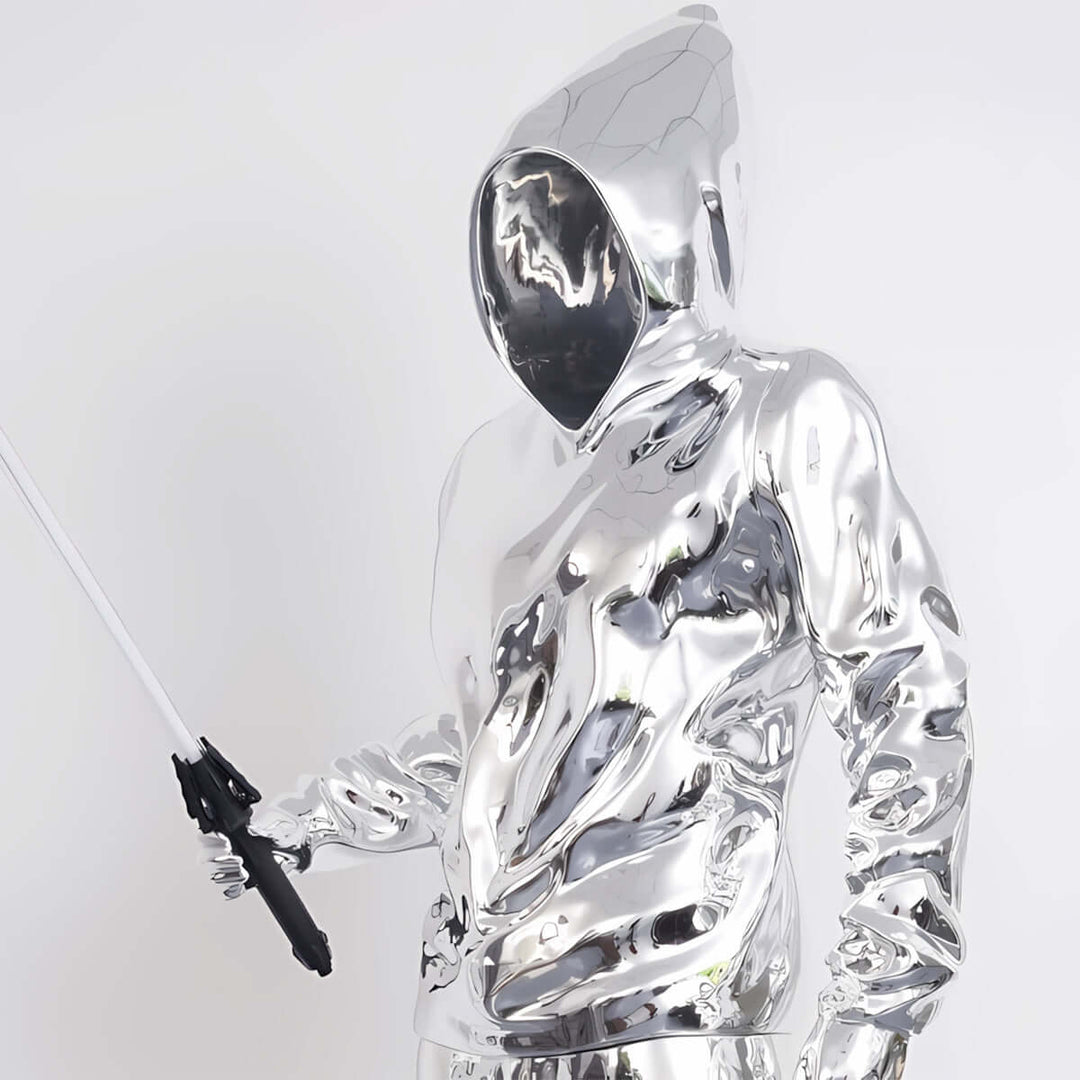 Sculptural silver figure in a hooded sweatshirt holding a lightsaber, reflecting a modern art aesthetic.