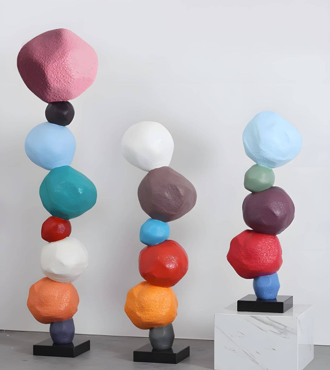 Colorful stacked stone resin sculptures, ideal for Art Deco living room decorations and decorative ornaments.