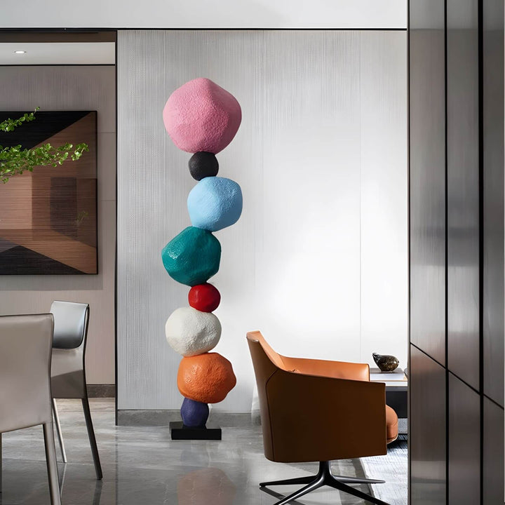 Colorful stacked stone sculpture as decorative ornament in a modern living room.