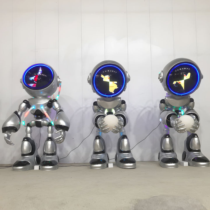 Three futuristic robot sculptures with glowing displays, showcasing innovative design and colorful lights in modern decor.