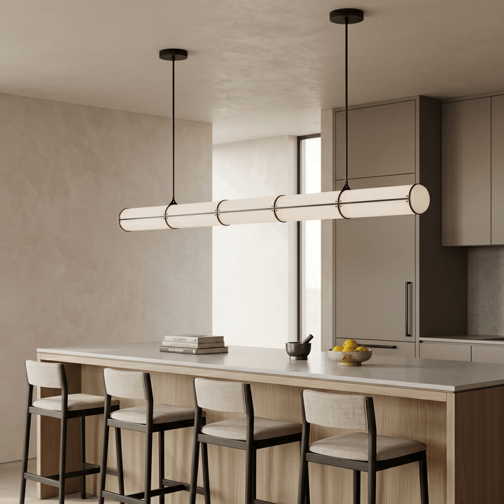 Black Acrylic Endless linear pendant light above a light wood kitchen island with four counter stools