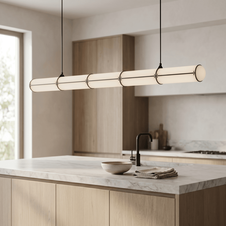 Black Acrylic Endless pendant light shown at an angle above a marble kitchen island