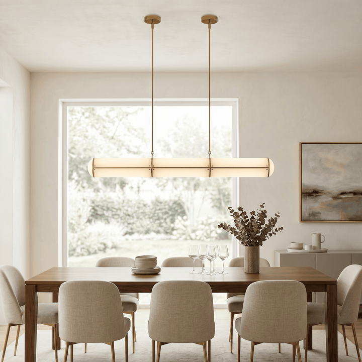 Brass Acrylic Endless dining room pendant light above a wood table in a bright contemporary interior