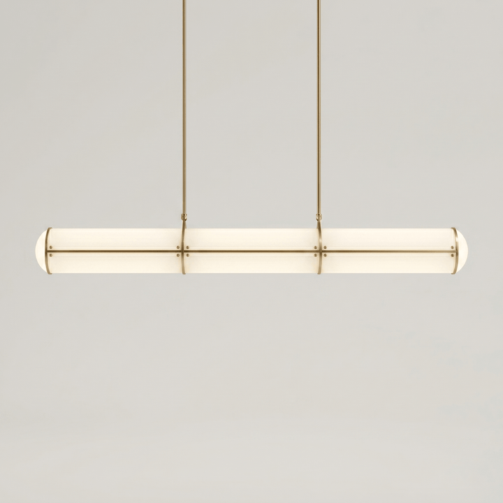 Front product view of the brass Acrylic Endless linear pendant light with a softly illuminated acrylic shade