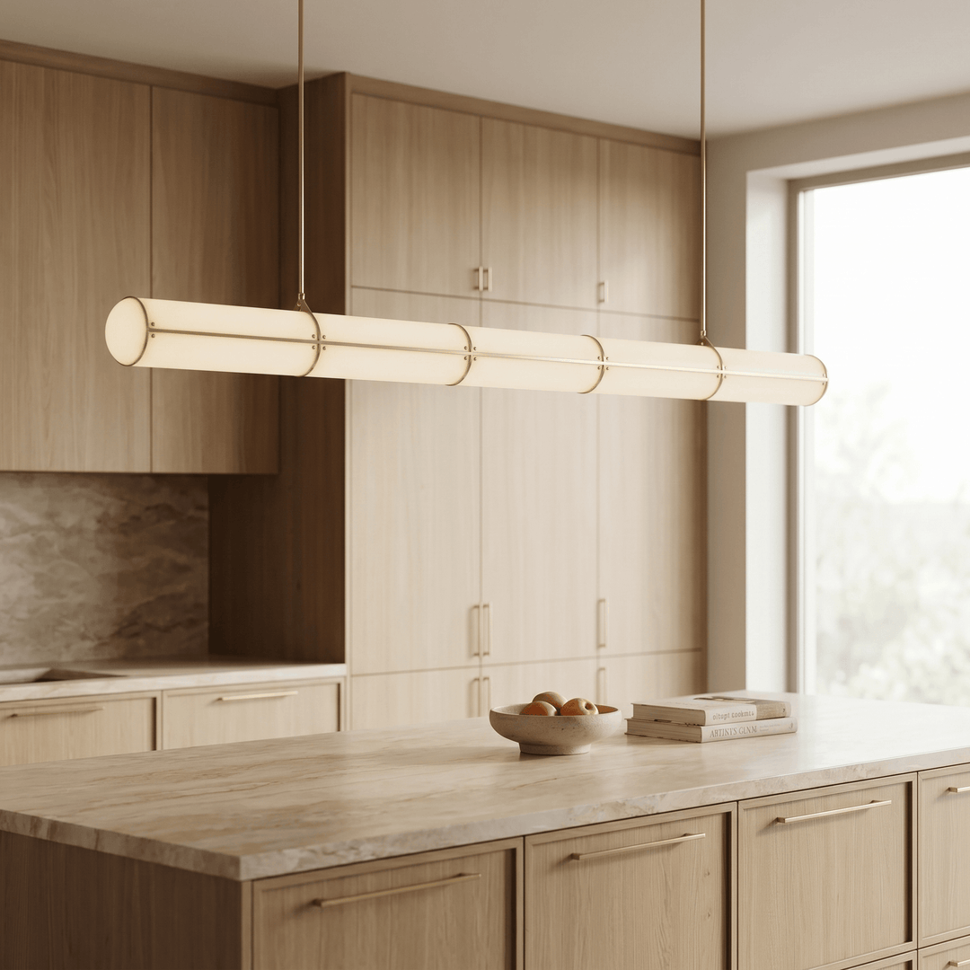 Angled view of the brass Acrylic Endless kitchen island pendant light in a light wood kitchen