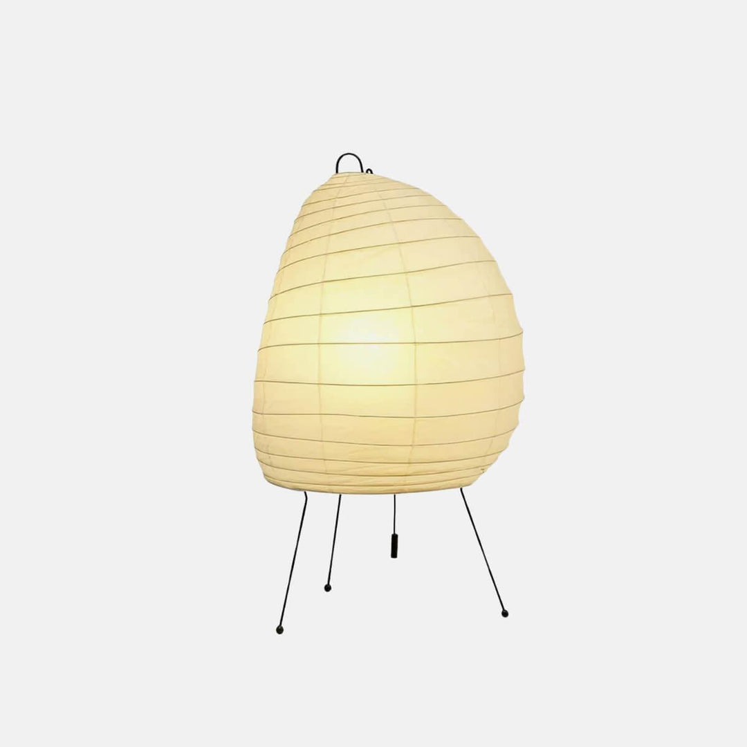 Front view of the glowing Akari 1N Table Lamp on a clean white background