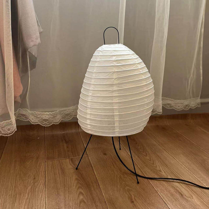 Angled view of the Akari 1N Table Lamp showing its paper texture and wire frame