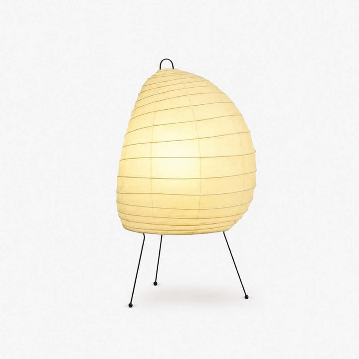 Akari 1N Table Lamp with a glowing rice paper shade and black tripod legs