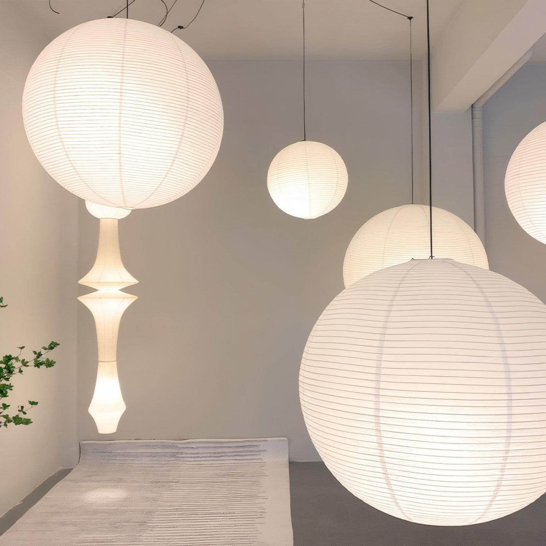 Round rice paper lanterns displayed with sculptural paper pendant lights