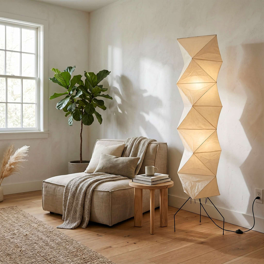 Akari UF4-L8 living room floor lamp beside a lounge chair in a bright reading nook