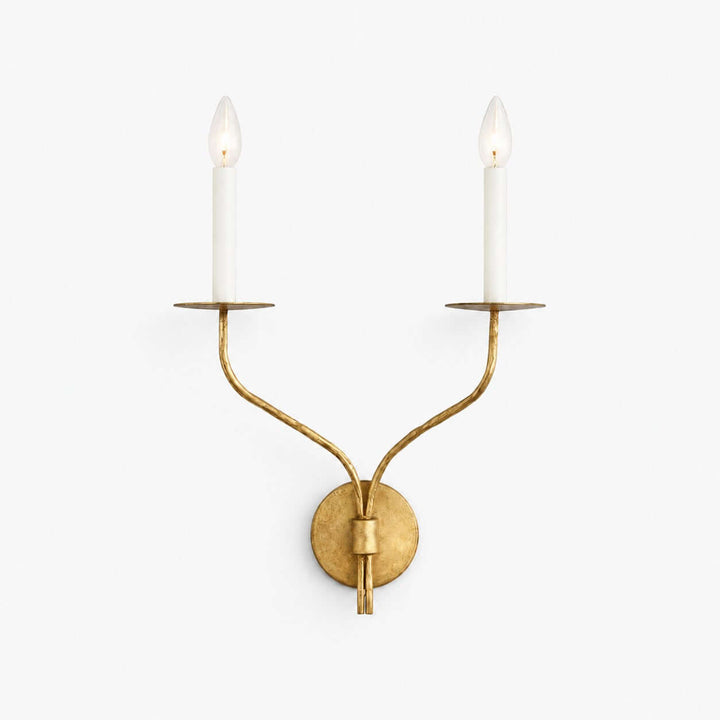 Avenli aged brass two-light candle wall sconce with curved arms and exposed candelabra bulbs
