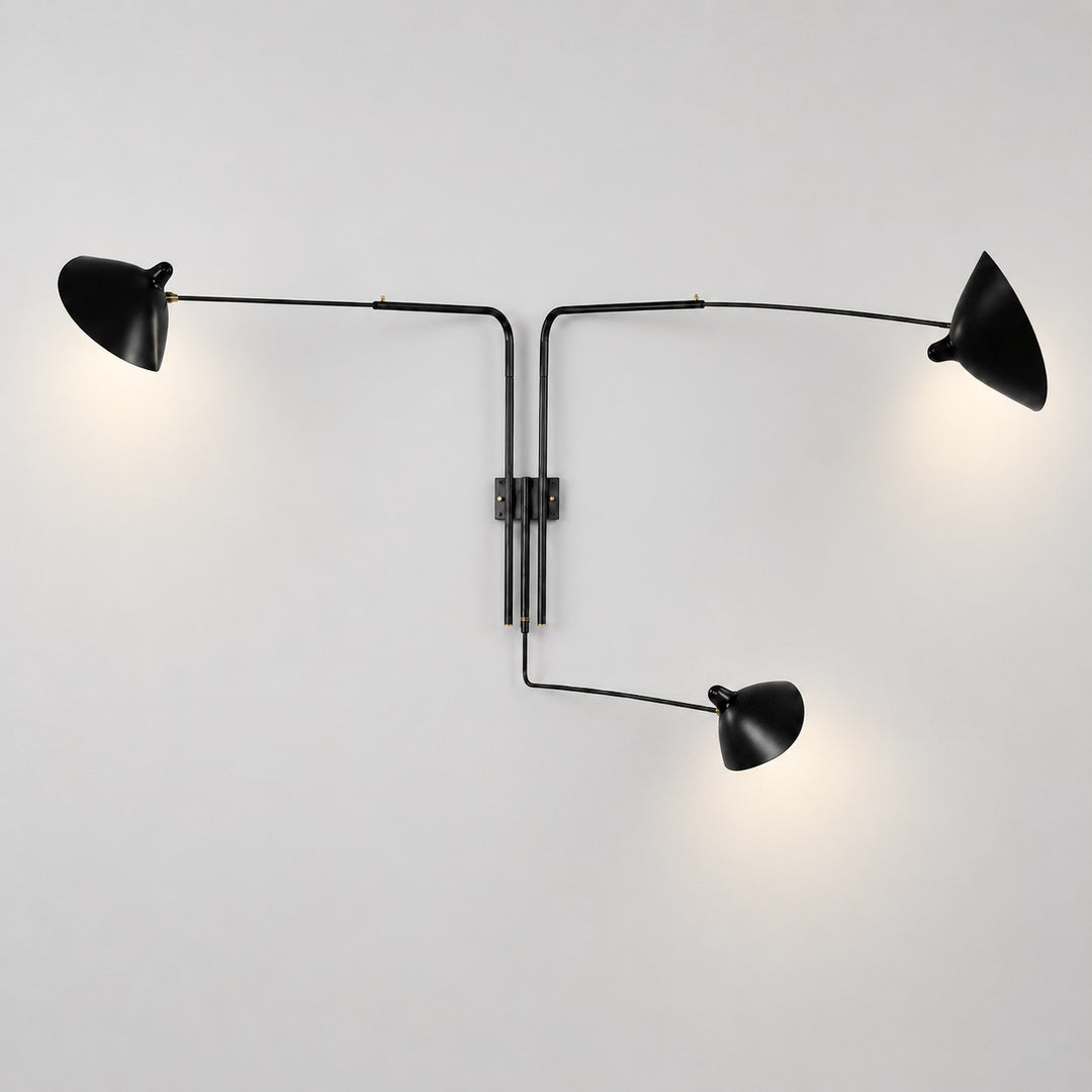 Black three-light wall sconce with long adjustable arms and directional cone shades