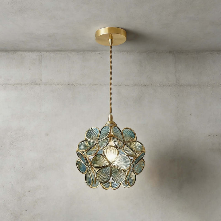 Blue textured glass petal pendant light with antique brass frame and ceiling canopy