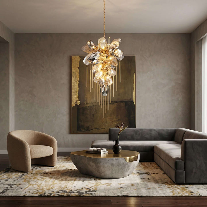 Tall Britannica chandelier with cascading glass rods in a contemporary living room seating area.
